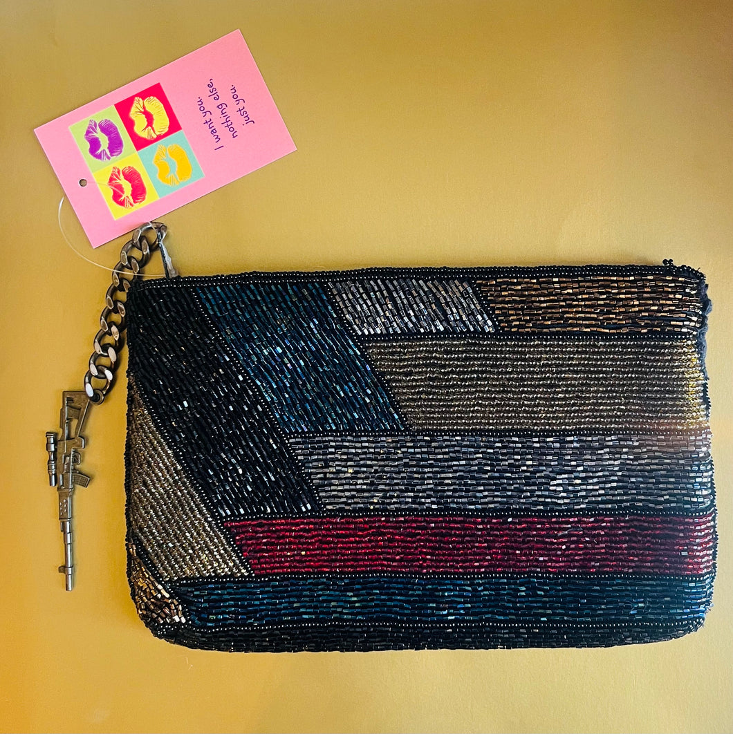 Reworked vintage sequin gun motif clutch purse